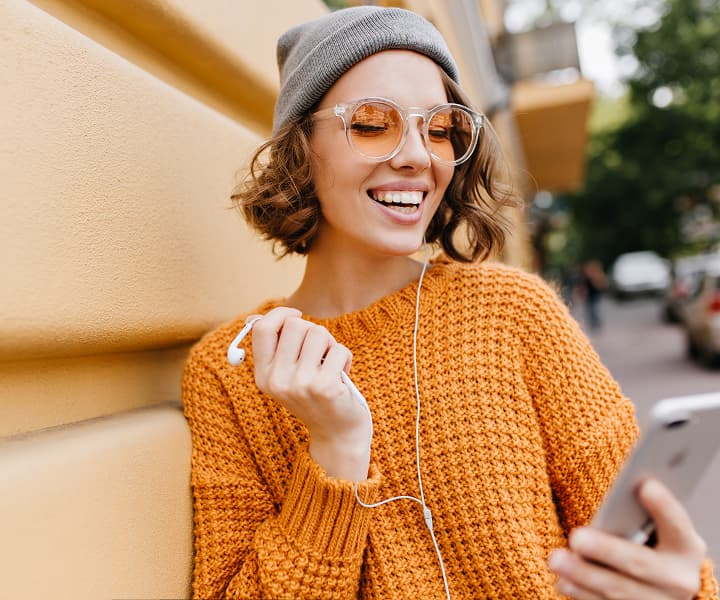 Happy student learning on a smartphone