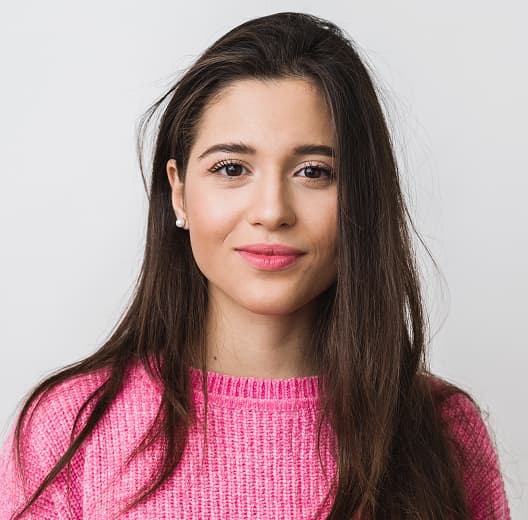 Camila Garcia from Marketing in front of a neutral background